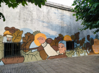 A artista Ceciro pintou na antiga escola de Firmistáns un mural dedicado ás leiteiras e ao traballo das mulleres amesás