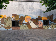 A artista Ceciro pintou na antiga escola de Firmistáns un mural dedicado ás leiteiras e ao traballo das mulleres amesás